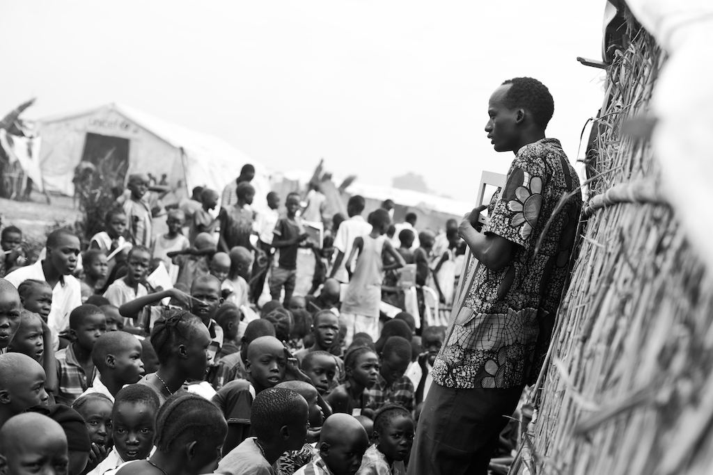 A math teacher in a Protection of Civilian site in South Sudan teaching boys and girls. Photography by Samer Muscati/Human Rights Watch.