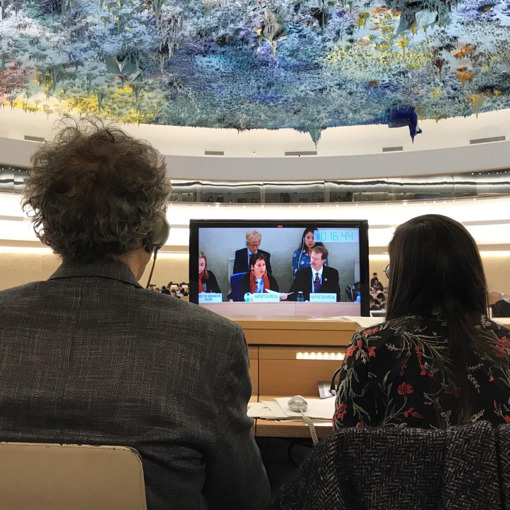  Bruce Porter (left) and Julieta Perucca (right) watch the special rapporteur present her report to the Human Rights Council on 4 March 2019.