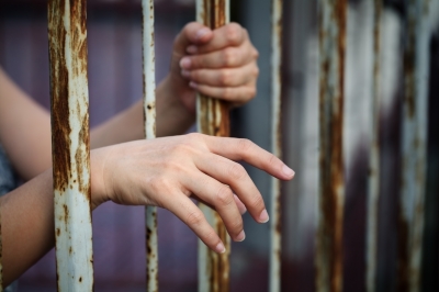 Prisoner's Hand on Bars stock image